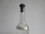 doe de vacuümdop op de fles