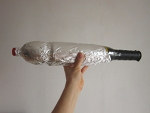 doe aluminiumfolie om de fles